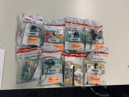 Money, cash stashed inside PVC pipes, a firearm, cut-up number plates and gold seized in Victoria's third biggest armed robbery on a gold dealer in Melbourne's CBD in 2020. Picture: Supplied