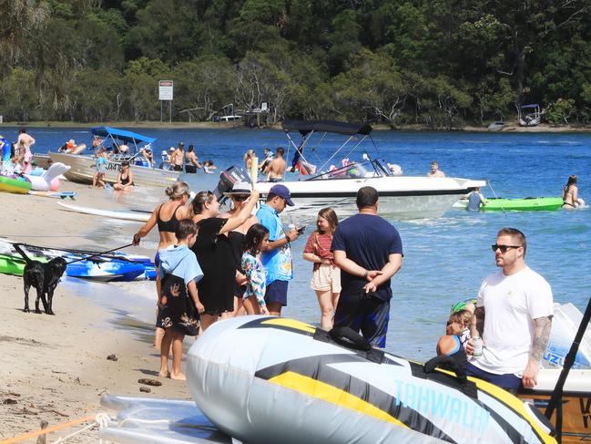Tallebudgera Creek was packed with families, boats and swimmers. Photo: Scott Powick