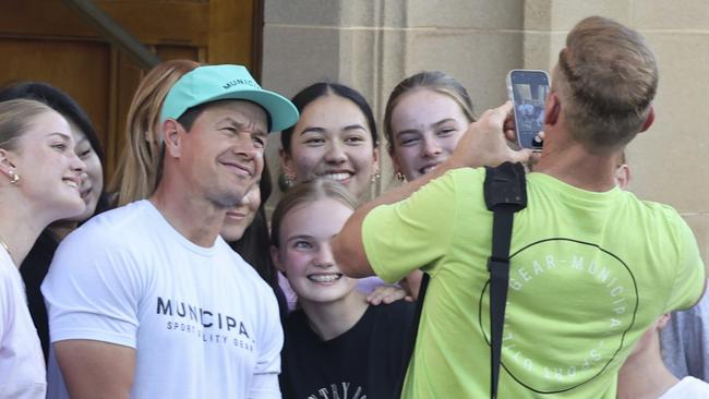 Mark Wahlberg's Mass of Fans! Movie star, Mark Wahlberg, who is a devout Catholic, headed to evening Mass at church in Sydney's Rose Bay. Photo: Media Mode