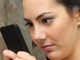 RendezView. Teenager girl in the shower obsessed with the smart phone under a water jet. (Pic: iStock)