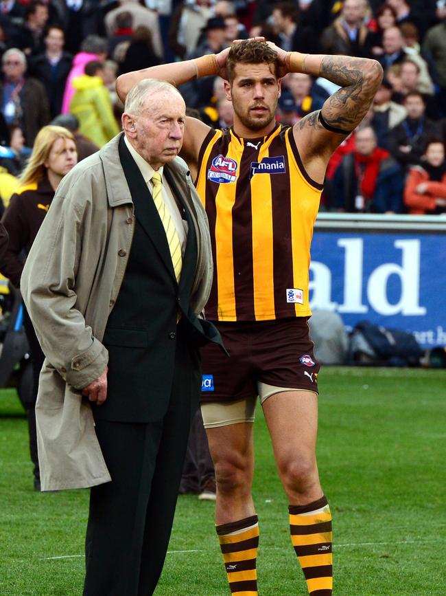 Commiserating with Lance Franklin in 2012. Picture: Wayne Ludbey