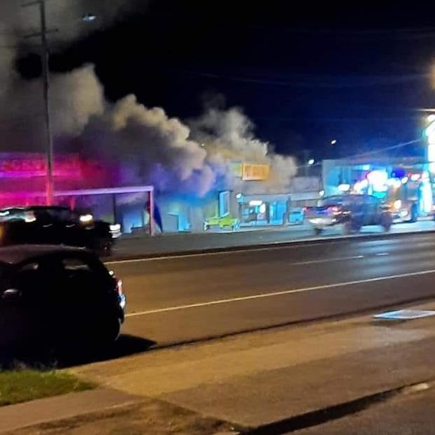 Fire engulfs the Slacks Creek retail centre. Picture: Facebook.