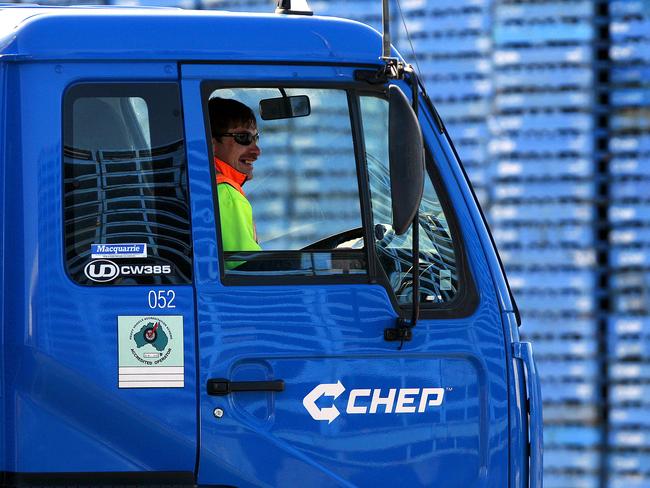 A worker sits inside a truck at Brambles Ltd.'s CHEP pallet service center outside Melbourne, Australia, on Monday, Aug. 17, 2009. Brambles Ltd., the world's biggest supplier of pallets used to move and store goods in factories, will announce full-year earnings on Aug. 20, 2009. Photographer: Luis Enrique Ascui/Bloomberg