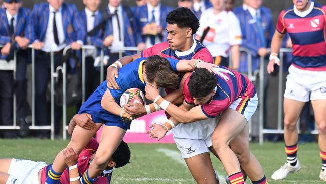 Adam Davis tackled by Roman Siulepa (middle) and Trent Picot (right) GPS First XV rugby between BSHS and Toowoomba Grammar. Saturday July 13, 2024. Picture, John Gass