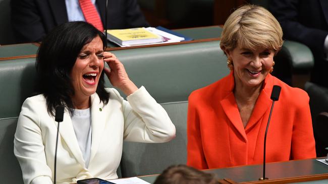 Member for Chisholm Julia Banks and former Liberal deputy leader Julie Bishop share a laugh during a division in the House of Representatives on Monday. Picture: AAP