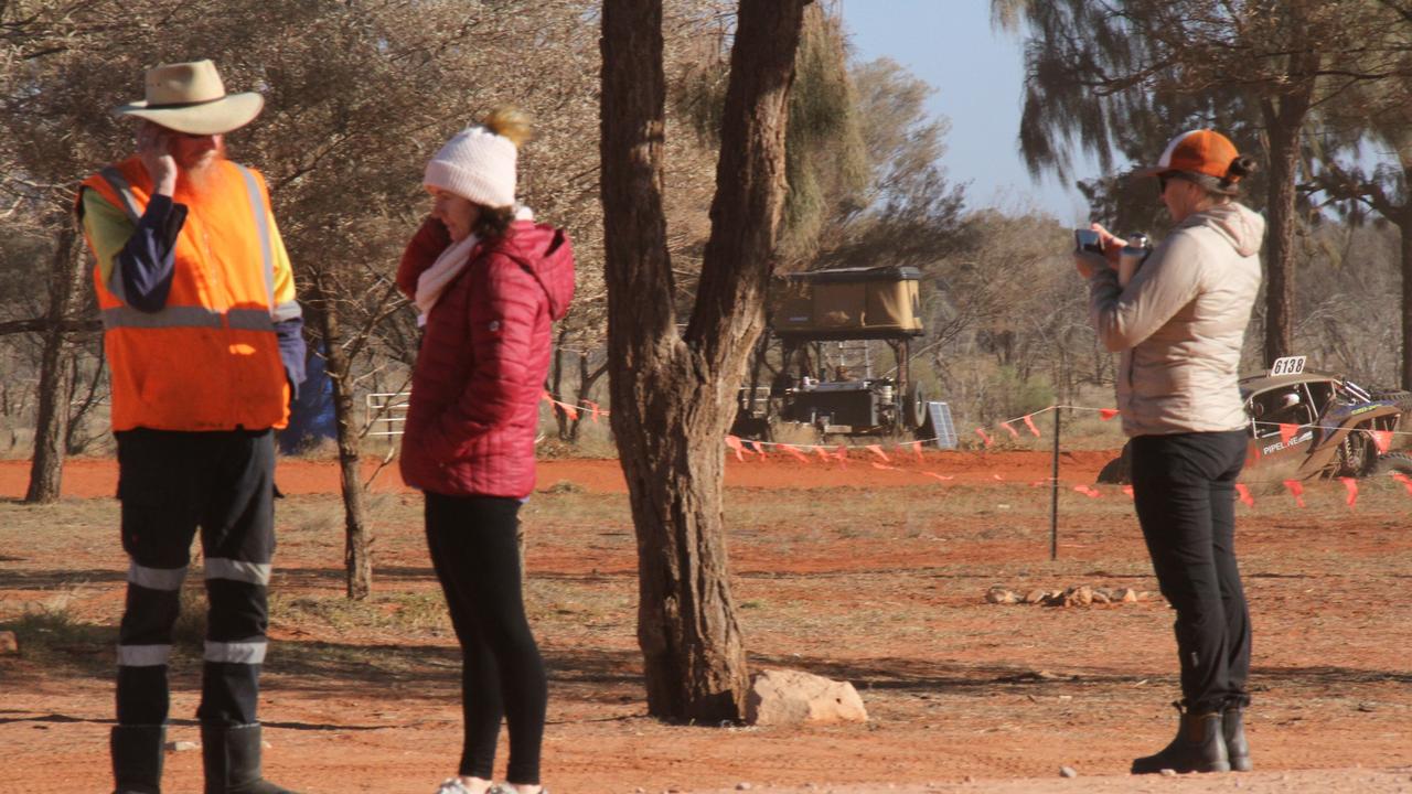 The 2025 Finke Desert Race has begun, with hundreds of punters lining the track south of Alice Springs to catch the action. Picture: Gera Kazakov