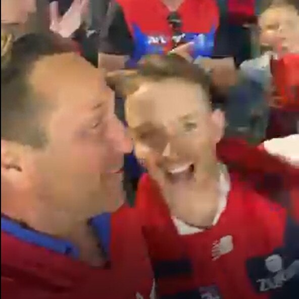 Footage of Hayden Burbank &amp; Mark Babbage celebrating the Melbourne football club’s premiership.