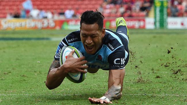 Waratahs player Israel Folau crosses over to score a try during thematch between the Queensland Reds and the NSW Waratahs at Suncorp Stadium.