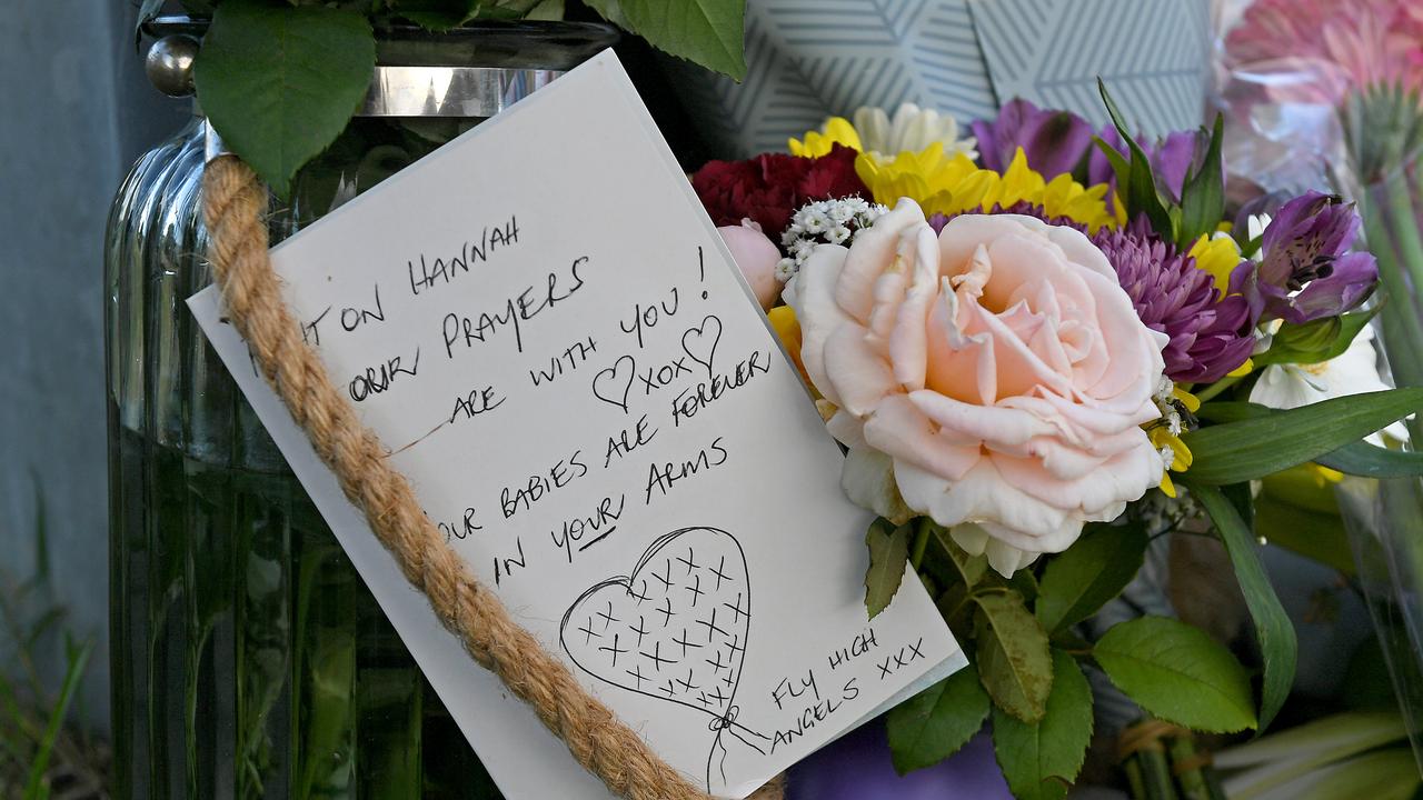 A card that reads: “Our prayers are with you. Your babies are forever in your arms. Fly high angels”. Picture: AAP/John Gass