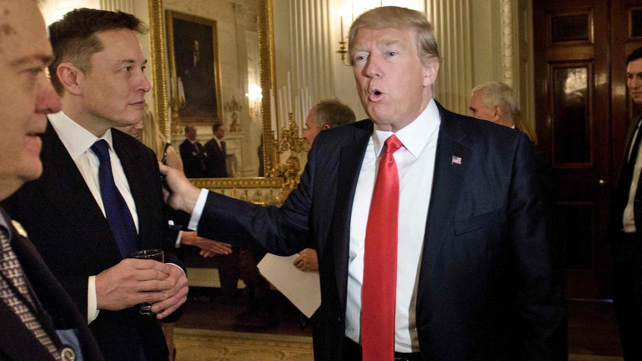 Trump talks with Musk during a meeting with business leaders in the State Dining Room of the White House in February 2017. Picture: Brendan Smialowski/AFP