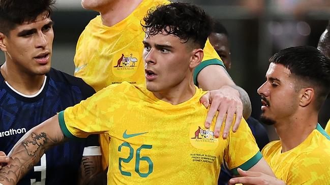 SYDNEY, AUSTRALIA - MARCH 24: Alexander Robertson #26 of the Socceroos exchanges heated words with the Ecuador players during the International Friendly match between the Australia Socceroos and Ecuador at CommBank Stadium on March 24, 2023 in Sydney, Australia. (Photo by Mark Kolbe/Getty Images)