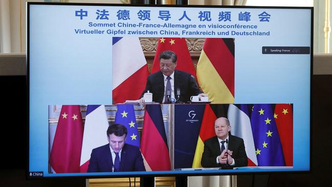 The three-way summit between Xi Jinping, Emmanuel Macron and Olaf Scholz on Tuesday night. Picture: AFP