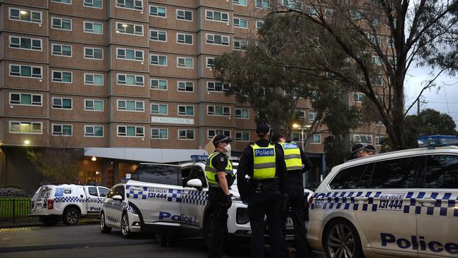 Police keep guard at the towers. Picture: Josie Hayden