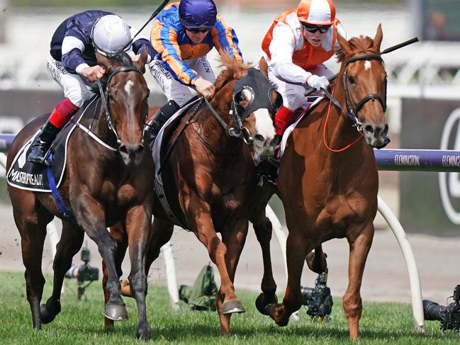 Craig Williams and Vow And Declare (right) claim victory in a thrilling finish.