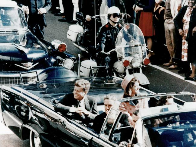 President John F Kennedy in the presidential limousine before his assassination. Picture: Getty