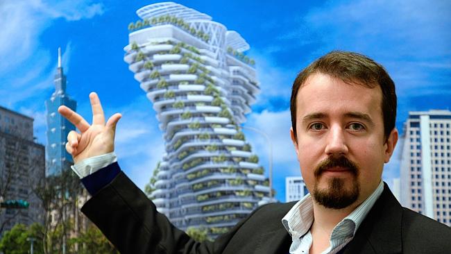 Vincent Callebaut poses as he presents a picture of one of his futuristic projects on "the city of tomorrow".