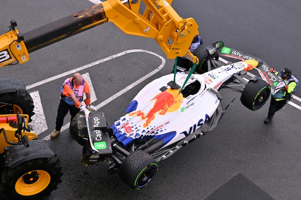 Marshals tow the car of RB's French driver Isack Hadjar after a crash at the Australian Grand Prix