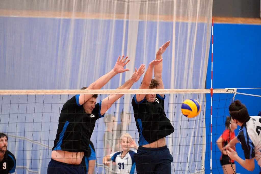 Jaek Passier (left) and Ethan Farquarson of Remember the Titans against Brisbane Volleyball Club in the final of the Clash of the Titans volleyball tournament at Harristown State High School gym, Sunday, February 25, 2018. Picture: Kevin Farmer