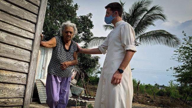 French priest Gregoire de Lambilly visits an elderly poor peasant in the village of Placetas, Santa Clara Province, Cuba. In Placetas, the hometown of Cuban President Miguel Diaz-Canel, the support of food, medicines and prayers given by a group of French priests and foreign nuns has become essential to the people of village.