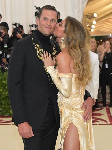 Gisele Bündchen gives husband Tom Brady a kiss at the 2018 Met Gala. Picture: Getty