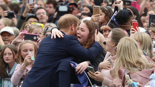 Prince Harry hugs India. Picture: Alex Coppel