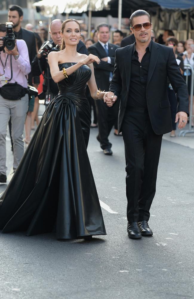 WHAT SHE WORE: Angelina Jolie in black dress with black leather shoulder  bag with gold chain strap in Sydney on September 27