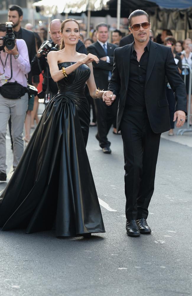 Angelina Jolie and Brad Pitt do ‘black magic’ with serious style.