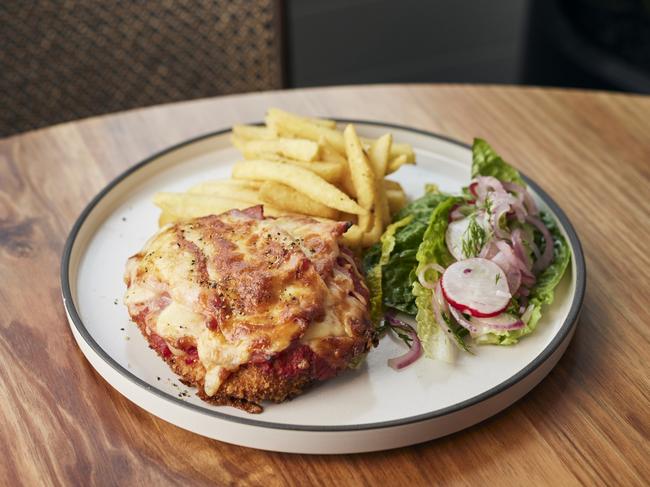 The Telegraph Hotel's Nicholls free-range chicken parmi includes a crunchy breaded coating and is served with a side of excellent chips. Picture: Remi Chauvin