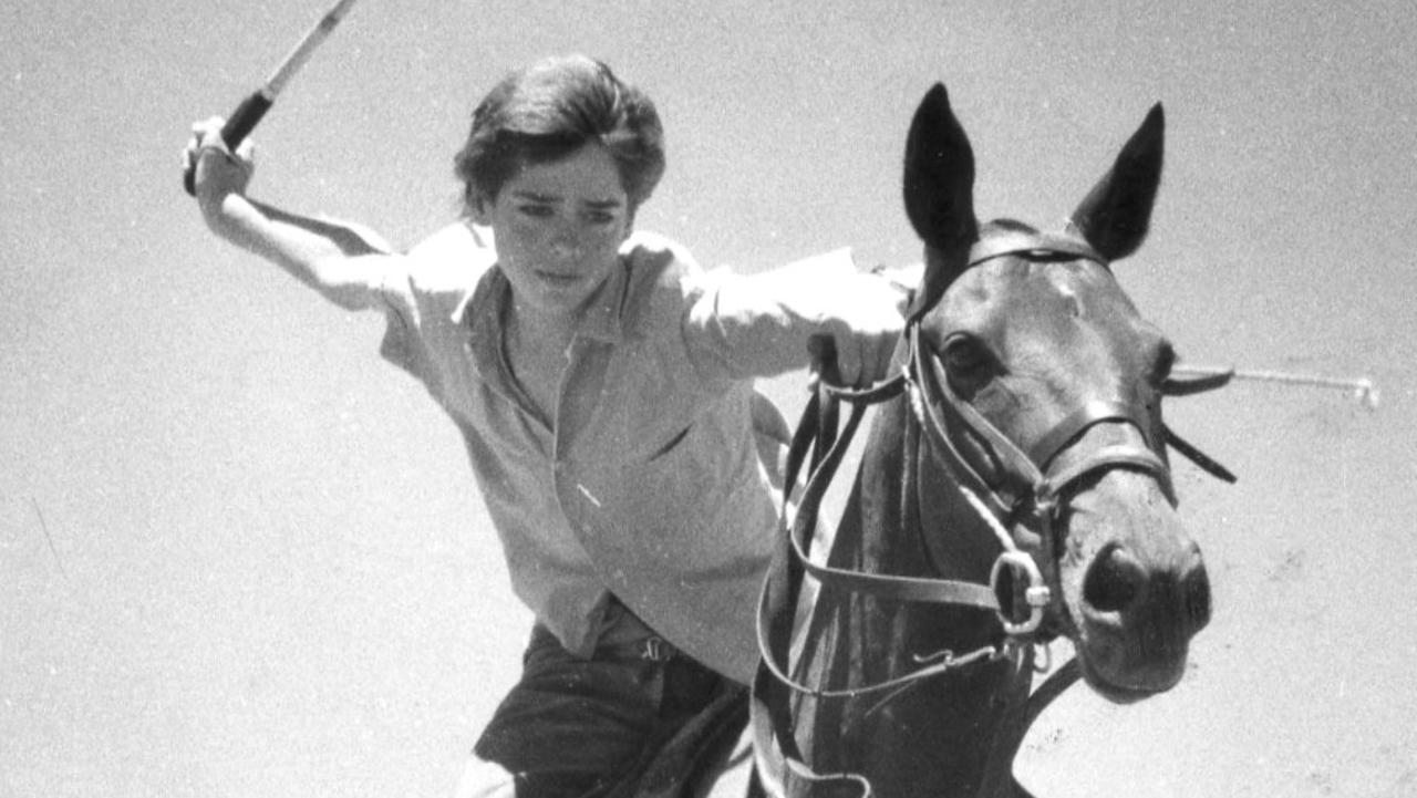 A young polo player Gillon McLachlan, 14, of Mount Pleasant, and horse Julie pictured on January 27, 1988. The horse is being prepared for its new rider, Prince Charles, when he plays in a polo match during a royal visit to Adelaide. Picture: Advertiser library.