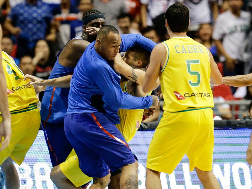 Nathan Sobey (C-R) of Australia gets into a brawl with Andray Blatche (back) and Calvin Abueva (C-L) of the Philippines during the FIBA Basketball World Cup 2019 Group B qualifier match between the Philippines and Australia in Manila, Philippines, 02 July 2018. EPA / MARK R. CRISTINO