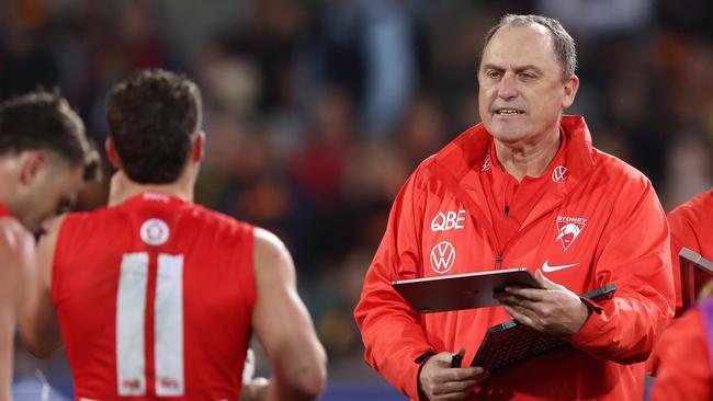 John Longmire speaks to Tom Papley. Picture: Sarah Reed/AFL Photos via Getty Images