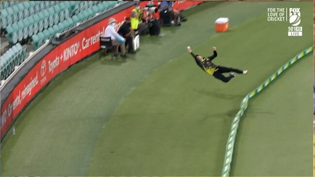 Steve Smith flies through the air before crashing to the turf.