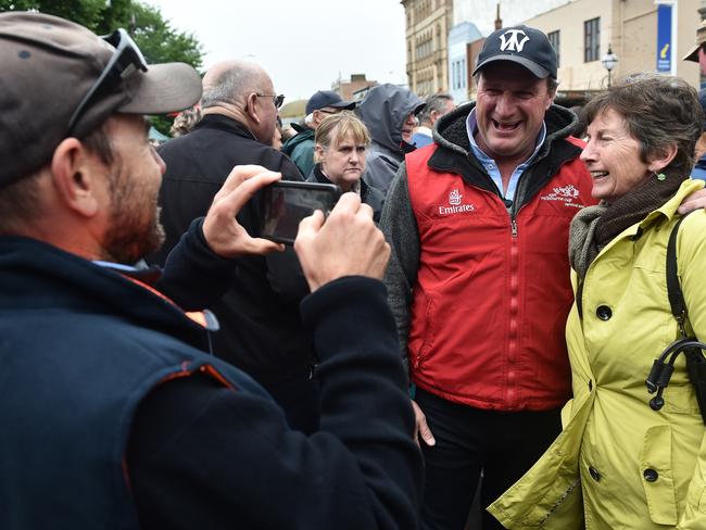 Melbourne Cup-winning trainer Darren Weir (centre) is certain to be a popular figure on Ballarat Cup Day. Picture: AAP