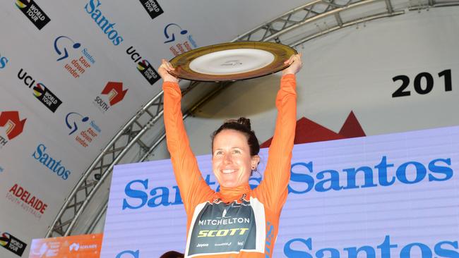 Amanda Spratt celebrates on the podium after winning the Women's Tour Down Under in 2018.