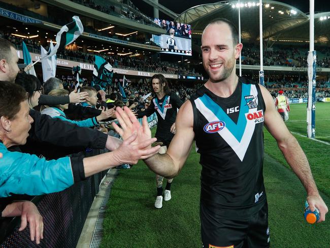 ADELAIDE, AUSTRALIA - JULY 29: Matthew Broadbent of the Power celebrates the win with fans during the round 19 AFL match between the Port Adelaide Power and the St Kilda Saints at Adelaide Oval on July 29, 2017 in Adelaide, Australia.  (Photo by Michael Dodge/Getty Images)