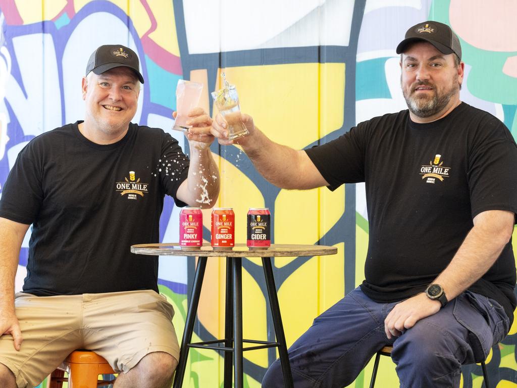 One Mile Brewery co-founders Stuart Brown and Bardy Bayram cheers to having their locally made alcoholic beverages sold at the Darwin Festival. Picture: Floss Adams.