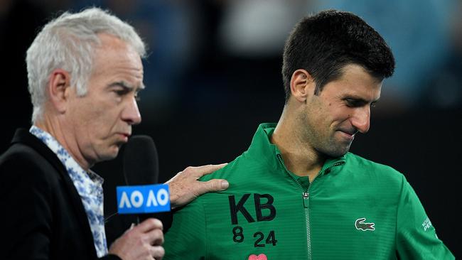 Novak Djokovic being interviewed by John McEnroe at the 2020 Australian Open. Picture: Lukas Coch