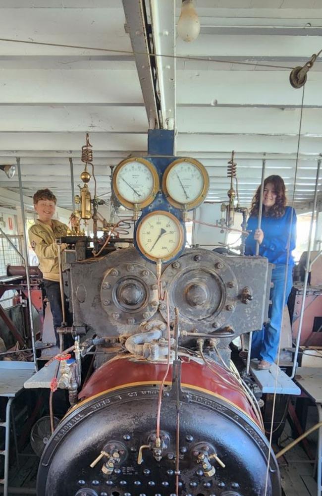 Mr Auditori’s children, Lucia and James cleaning the Original Marshall steam engine of Paddle Steamer Melbourne during their school holidays. Picture: Supplied.