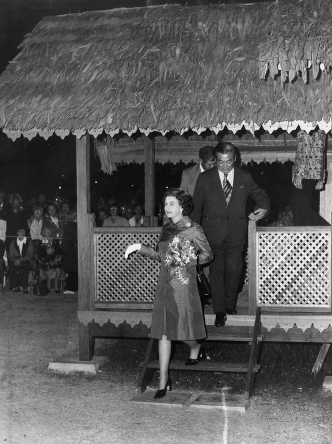 The Queen spent the night attending North Malaysia Week displays at Elder Park on March 22. Here, she leaves a kampong after inspecting batik paintings.