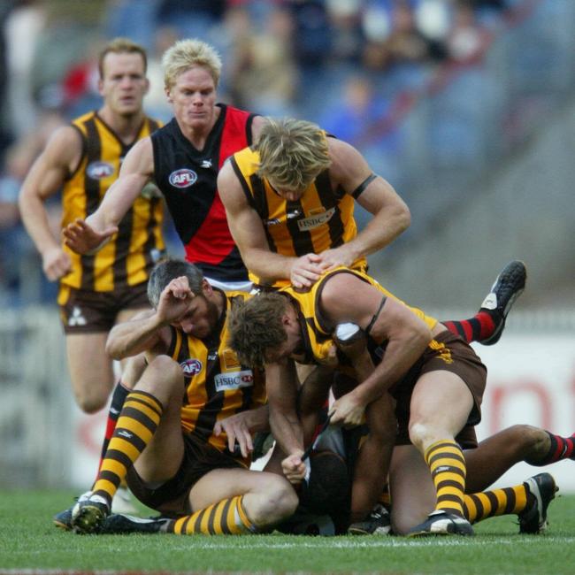 Players brawl during the infamous Hawthorn v Essendon AFL game in 2004. Picture: Darrin Braybrook