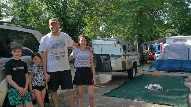 Iain Podd and Tania Snell with children Callum and Ellowyn at their campsite at NRMA Bairnsdale riverside holiday park. Picture: Sean Jackson