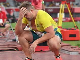 Australia's Matthew Denny reacts while competing in the men's discus throw final during the Tokyo 2020 Olympic Games at the Olympic Stadium in Tokyo on July 31, 2021. (Photo by Andrej ISAKOVIC / AFP)