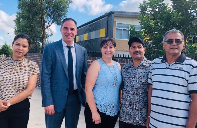 Labor Education spokesman Jihad Dib (suit), Camden state Labor candidate Sally Quinnell (centre) and concerned parents at Oran Park Public School