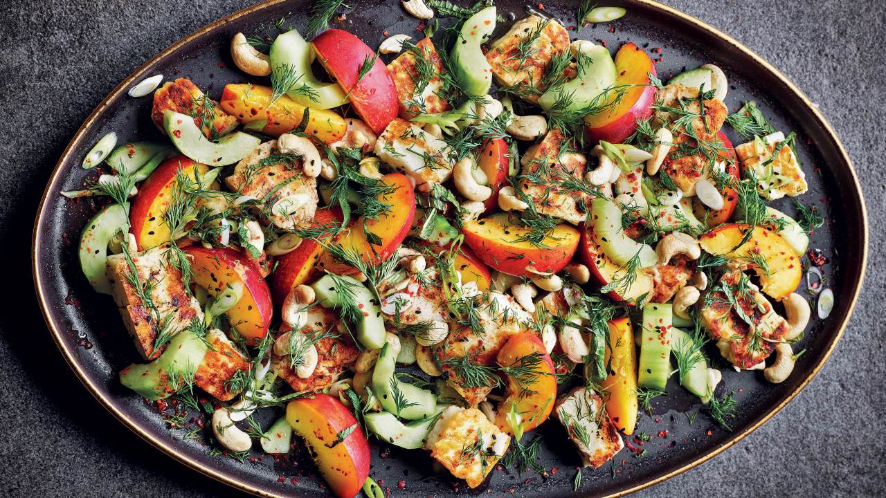 Nectarine, halloumi and cucumber salad with cashews. Image: Supplied