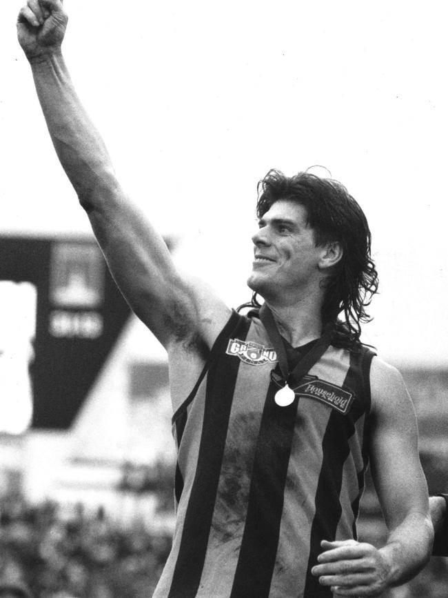 Gary Ayres shows the Hawk are No 1, after the 1991 grand final.