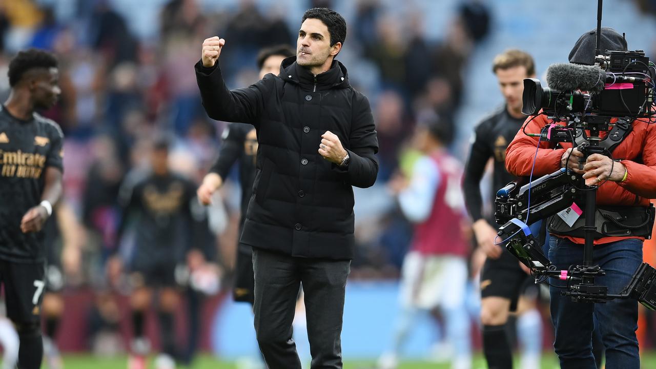 Arsenal boss Mikel Arteta celebrates with the travelling Gunners support after a crucial win against Aston Villa. (Photo by Shaun Botterill/Getty Images)