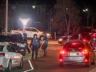 POLICE PRESENCE: Dozens of police, including some in riot gear, gather in Taylors Hill, Melbourne, after a large group of youths wreaked havoc in the area. Picture: Jason Edwards