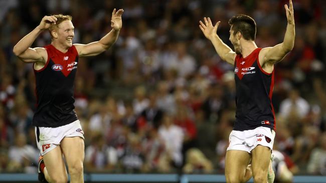 Clayton Oliver and Alex Neal-Bullen celebrate a goal for Melbourne. Picture: Mark Dadswell