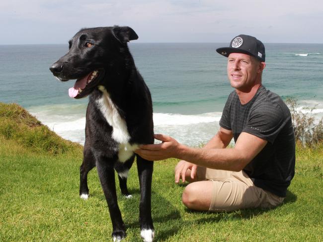 Professional surfer Mick Fanning with his beloved dog Harper, on top of Duranbah Hill, Coolangatta.