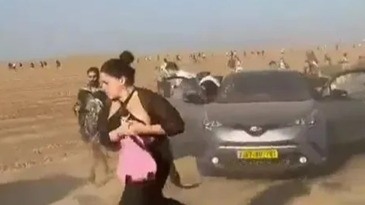 Footage showed terrified ravers fleeing a music festival in Israel where rescuers have found 260 bodies after Hamas stormed the area.